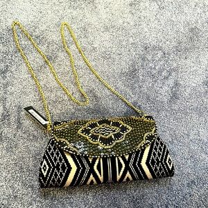 Black and gold clutch, chain strap crossbody bag